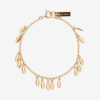 Bracelet en métal brillant avec pendentifs en forme de feuilles