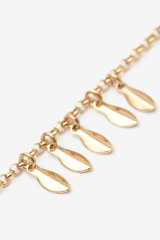 Bracelet en métal brillant avec pendentifs en forme de feuilles