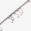Bracelet en métal brillant avec pendentifs en forme de feuilles